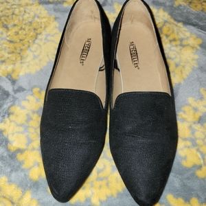 Black Seychelles pointed flats with gold trim on heels